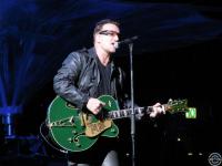 green guitar in the rain